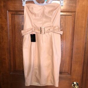 Bebe NWT strapless vegan leather dress. Size Medium. Belt with gold trim.
